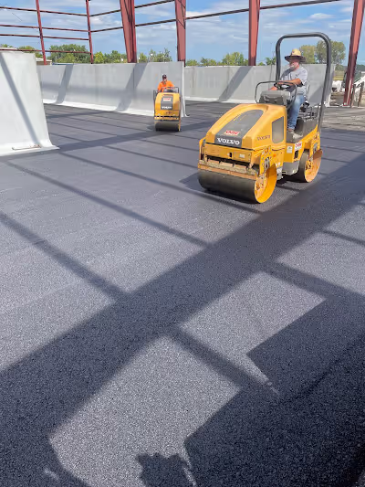 Eldridge Paving crew laying fresh asphalt